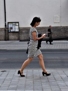 A woman uses a city map on her mobile phone